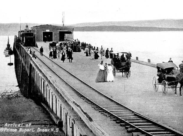 Passengers walking on the wharf in Digby, Circa 1900s